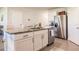 Kitchen island with granite countertop and white shaker cabinets at 17921 Canopy Pl, Bradenton, FL 34211
