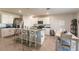 Open concept kitchen with island, stainless steel appliances, and dining area at 17921 Canopy Pl, Bradenton, FL 34211