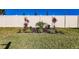 Landscaped area with tropical plants and a privacy fence at 17921 Canopy Pl, Bradenton, FL 34211
