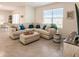 Open living room with L-shaped sofa and view into dining area at 17921 Canopy Pl, Bradenton, FL 34211