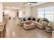 Open living room with L-shaped sofa and view into dining area at 17921 Canopy Pl, Bradenton, FL 34211