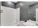 Clean bathroom with a white tub and updated fixtures at 2063 Lynx Run, North Port, FL 34288