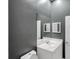 A clean bathroom featuring a modern vanity and ample mirror space at 2063 Lynx Run, North Port, FL 34288