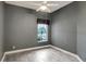 Bedroom featuring neutral walls, tile floors, and a ceiling fan at 2063 Lynx Run, North Port, FL 34288
