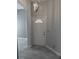 Bright entryway features a stylish light fixture and tiled flooring at 2063 Lynx Run, North Port, FL 34288