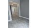 Spacious hallway with tile flooring and neutral paint at 2063 Lynx Run, North Port, FL 34288
