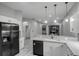 Bright kitchen featuring granite countertops and stainless steel appliances at 2063 Lynx Run, North Port, FL 34288