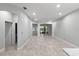 Open-concept living room with tile floors and ample natural light at 2063 Lynx Run, North Port, FL 34288