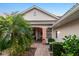 Side exterior view of villa, showing pathway and additional outdoor space at 2063 Lynx Run, North Port, FL 34288