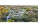 Aerial view of the property and surrounding neighborhood near the water at 220 Ciboa Ave, North Port, FL 34287
