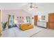 Main bedroom with vaulted ceilings, a plush bed, and plenty of natural light at 220 Ciboa Ave, North Port, FL 34287