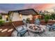Charming fire pit area with gray chairs for enjoying evenings outdoors at 220 Ciboa Ave, North Port, FL 34287