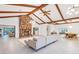 Open concept living area with a stone fireplace and modern decor at 220 Ciboa Ave, North Port, FL 34287