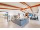 Spacious living room with vaulted ceilings, exposed beams, and fireplace at 220 Ciboa Ave, North Port, FL 34287