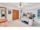 Bright home office with built-in shelving, desk, and large windows at 220 Ciboa Ave, North Port, FL 34287