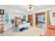 Home office with built-in shelving, desk, and access to a sunroom at 220 Ciboa Ave, North Port, FL 34287