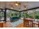 Relaxing screened porch with seating area and wood flooring at 220 Ciboa Ave, North Port, FL 34287