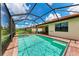 Enclosed pool and spa with patio and partial view of house at 24157 Spartina Dr, Venice, FL 34293