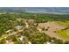 Aerial view showing home nestled in lush, wooded landscape at 2807 Country River Dr, Parrish, FL 34219