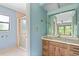 Bathroom with shower, vanity, and a view into another room at 2807 Country River Dr, Parrish, FL 34219