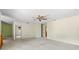 Large bedroom with ceiling fan and access to hallway at 2807 Country River Dr, Parrish, FL 34219