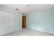 Light blue bedroom with double door closet at 2807 Country River Dr, Parrish, FL 34219