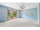 Primary bedroom with sliding glass doors to backyard at 2807 Country River Dr, Parrish, FL 34219