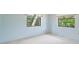 Simple bedroom with two windows and light walls at 2807 Country River Dr, Parrish, FL 34219