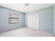 Bedroom with window and neutral walls at 2807 Country River Dr, Parrish, FL 34219