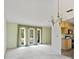 Open dining room with a chandelier and kitchen access at 2807 Country River Dr, Parrish, FL 34219