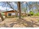Brick home with mature oak trees and a walkway to the entrance at 2807 Country River Dr, Parrish, FL 34219