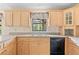Bright kitchen features ample cabinetry and a view to the backyard at 2807 Country River Dr, Parrish, FL 34219