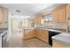 Kitchen with light wood cabinets and tile floors at 2807 Country River Dr, Parrish, FL 34219