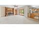 Living room with sliding doors to patio and kitchen access at 2807 Country River Dr, Parrish, FL 34219