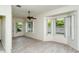 Bright living room with vinyl plank flooring and large windows at 315 Auburn Woods Cir # 315, Venice, FL 34292