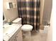 Bathroom with tub shower combo, and plaid shower curtain at 390 301 W Blvd # 30B, Bradenton, FL 34205