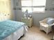 Bedroom with a comfy seating area, a dresser and window at 390 301 W Blvd # 30B, Bradenton, FL 34205