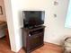 Living room entertainment center with a fireplace and TV at 390 301 W Blvd # 30B, Bradenton, FL 34205