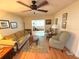 Comfortable living room with hardwood floors and a view into another seating area at 390 301 W Blvd # 30B, Bradenton, FL 34205