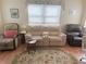 Relaxing living room with two leather recliners and hardwood floors at 390 301 W Blvd # 30B, Bradenton, FL 34205