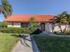 Condo with red tile roof and well-maintained landscaping at 6246 Draw Ln # 12, Sarasota, FL 34238