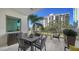 Private balcony with outdoor furniture and city views at 711 S Palm Ave # 203, Sarasota, FL 34236