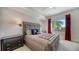 Spacious bedroom with plush bed and large window offering natural light at 711 S Palm Ave # 203, Sarasota, FL 34236