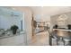 Open concept dining area with a view into the living room and kitchen at 711 S Palm Ave # 203, Sarasota, FL 34236