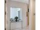 Bright entryway with glass console table and view to outdoor space at 711 S Palm Ave # 203, Sarasota, FL 34236