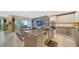 Open concept kitchen with island, stainless steel appliances and living room view at 711 S Palm Ave # 203, Sarasota, FL 34236