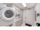 Laundry room with Whirlpool washer and dryer and extra counter space at 711 S Palm Ave # 203, Sarasota, FL 34236