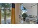 Bright living room with large windows and access to a patio at 711 S Palm Ave # 203, Sarasota, FL 34236