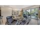Spacious living room with sliding glass doors leading to a balcony at 711 S Palm Ave # 203, Sarasota, FL 34236