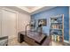 Home office with large desk, comfortable chair, and built-in shelving at 711 S Palm Ave # 203, Sarasota, FL 34236